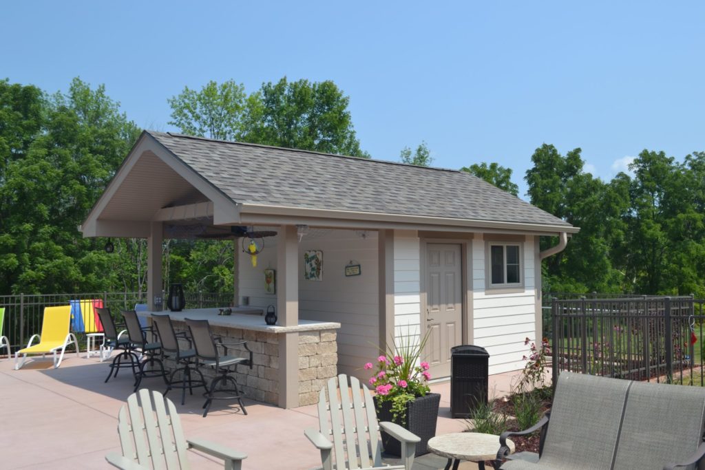 Pool house in Waukesha Wisconsin featuring side entry door for pool equipment storage.