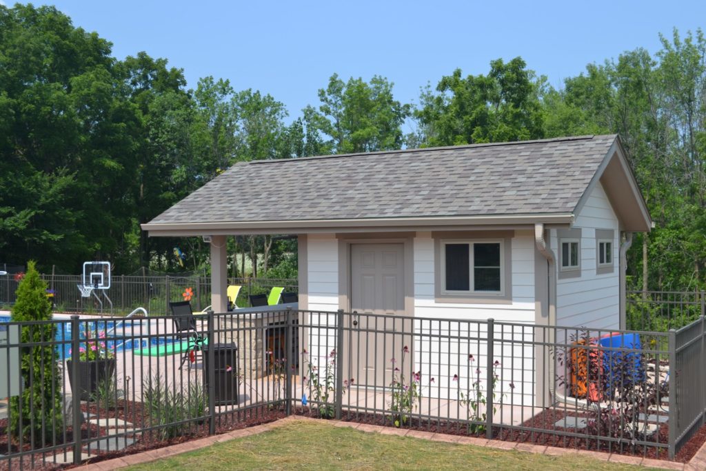 Pool house in Waukesha Wisconsin featuring side entry door for pool equipment storage.