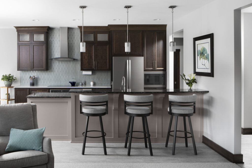 Kitchen island with bar seating in Waukesha custom ranch home
