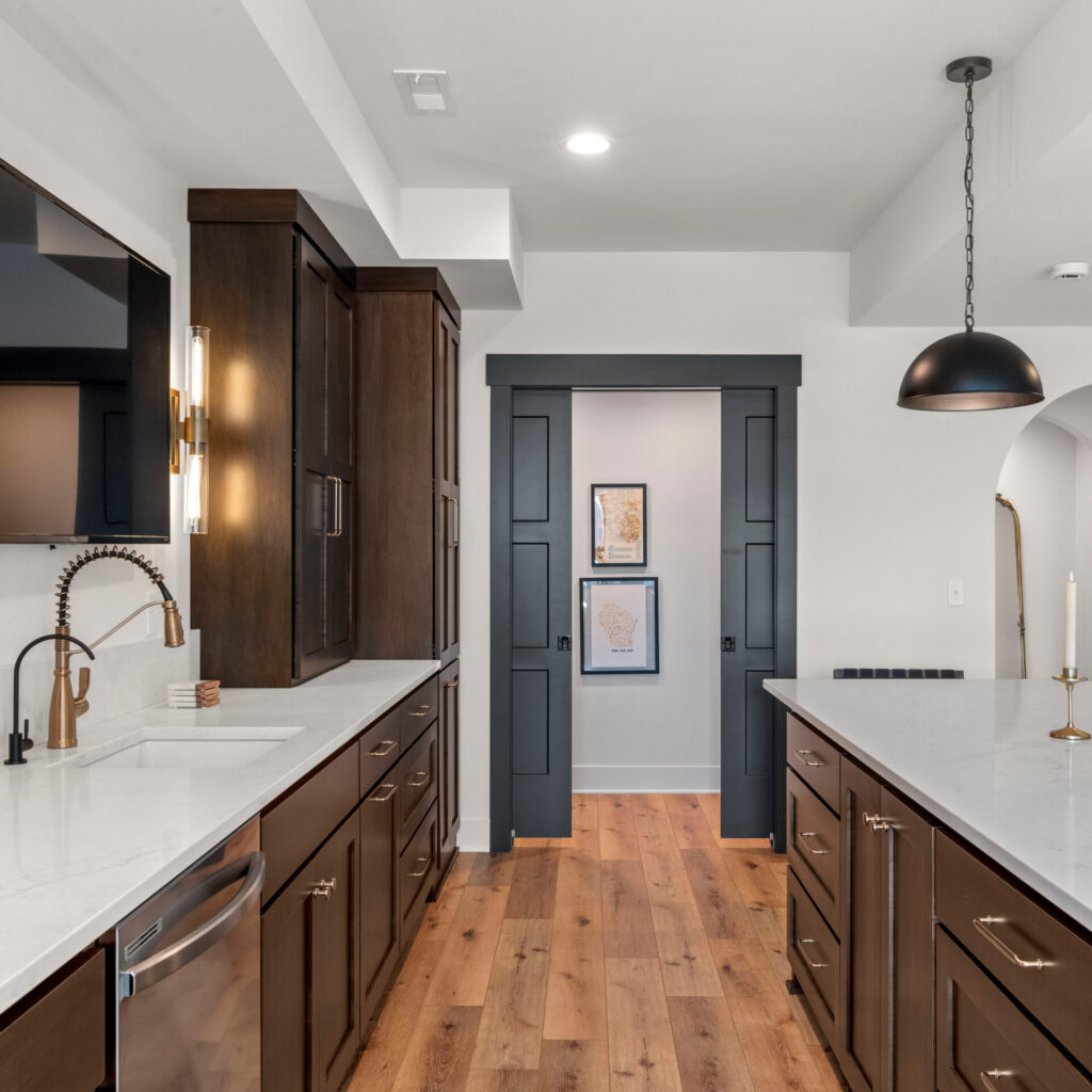 Custom basement bar with pocket doors remodeling project in Waukesha County